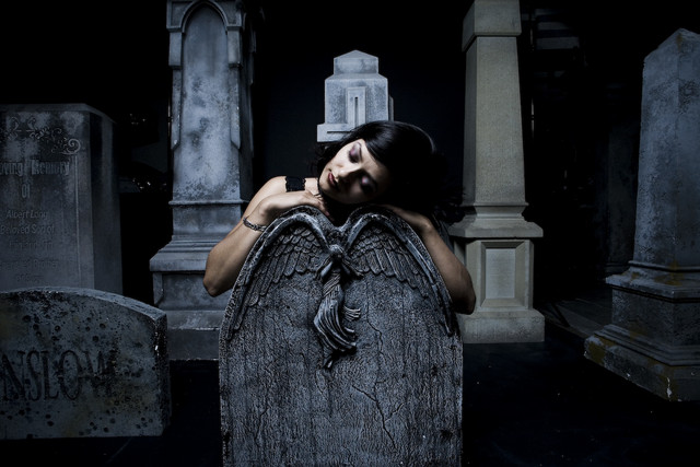 Gothic mourning woman on the tomb